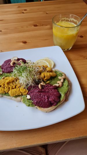 Smashed avocado 2x hummus toast and fresh orange juice at RGB and The Bean Hive in Kuala Lumpur