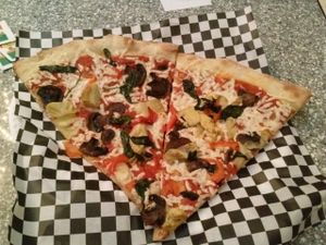 slices of SoHo vegan pizza at Plaza Hotel - Pop Up Pizza in Las Vegas