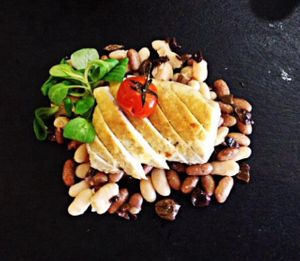 roasted tofu with taggiasche olives, beans and cherry tomatoes  at Gastronomia Le Quattro Stagioni in Adria