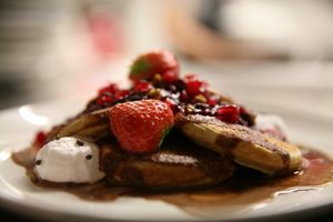 We make vegan food to indulge : ) There are always healthy options available but at times you just have to go all decadent: OmNam's gluten free pancakes with fresh berries, house made nutella, caramel sauce and whipped oat cream.  at OmNam in Helsinki