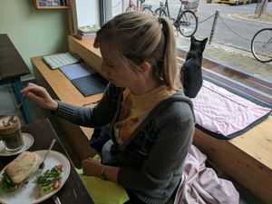 My lovely girlfriend and our new feline friend at Cafe Schnurrke in Cologne