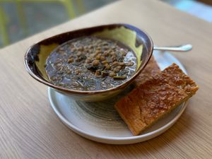 Spicy lentil and spinach soup with gluten-free chickpea flatbread at Sprout in Exeter