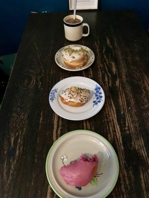 Elderberry, birthday cake, and pistachio rose doughnuts- and a cup of coffee :) at bloomer's in Toronto
