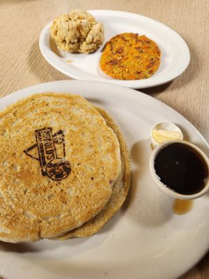 Vegan pancakes, vegan butter, syrup, vegan biscuit, and vegan breakfast sausage at Harold's Diner Soda Fountain & Farmacy in Eureka Springs