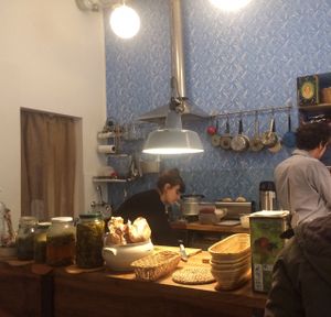 The inside looks like a cozy kitchen at Hummus Amamamusi in Krakow