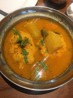 Chickpea flour doughnuts in a rich sauce  at Veg Kitchen in Tokyo