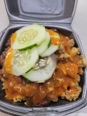 Today's menu of tofu, brown rice, red kidney beans, and cucumbers. at Mellow Moods Cafe in Tortola