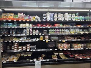 Vegan section with tofu, tempeh, seitan, vegan yogurt, and vegan cheese at HarvesTime Foods in Chicago