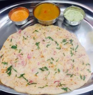 South indian pancake topped with veges served with lentil soup and coconut chutney. at Relish India in Surry Hills