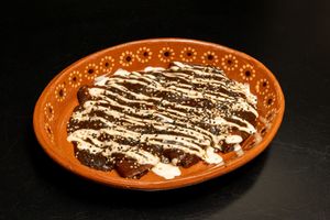 Enmoladas
Three hand-made tortillas filled with potato smothered in our gourmet mole (3 pcs). at El Tesorito de Jalisco in Mexico City