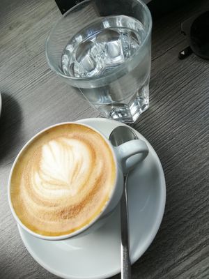 Oatmylk cappuccino at Blueorange Coffee and Bagel - Margaretenstrasse in Vienna