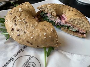 Bagel with rocket salad, red beet hummus, pickles and sweet mustard 💚  at Blueorange Coffee and Bagel - Margaretenstrasse in Vienna