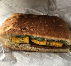 Hot Breakfast Sandwich devoured in my car. Maple sage breakfast sausage, eggy tofu, cream cheese & fig spread.  at The Herbivorous Butcher in Minneapolis