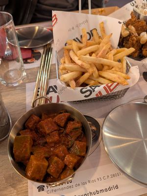 kimchi and fries with plum powder at Savor Hub - Korean Fried Chicken in Comunidad De Madrid