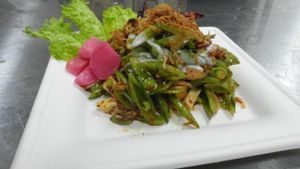 Supreme Snap Peas Delight
Thinly sliced snap peas tossed well with crushed peanuts, baked tofu, chili coconut-tamarind dressing and drizzled with crunchy shallots. at Happy Elephant Vegan in Long Beach