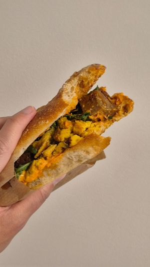 I always take bites before taking photos. Can confirm the sandwiches are perfect! at Kitsune Athens Bistrot in Athens