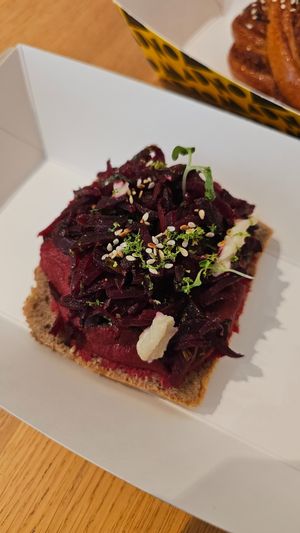 Hummus Beetroot Open Sandwich
Creamy beetroot hummus spread on a slice of our rye bread combined with sesame oil and toasted sesame seeds topped with roasted beetroot. at Nomad Bread & Coffee in Lefkosia