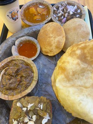 Special Mewari Thali : 
Bhature, Poori, Alu Sabzi, Chole, Special Dhaba Curry, Cashew Butter Milk, Mohan Halwa at Aloo Poori Express in Udaipur
