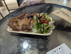 Today's special, lasagna with a side salad at Sacred Garden Plant Based Deli in Rhodes
