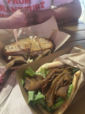 pastrami sandwich with sourdough bread and gyros pita  at Sacred Garden Plant Based Deli in Rhodes