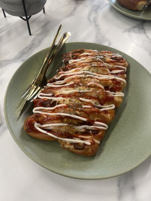 Korean sausage bread   at Canela Vegan Bakery & Cafe in Calgary