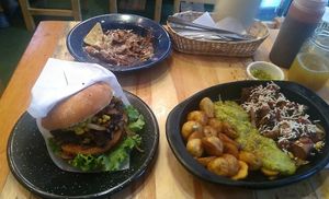 Hamburguesa, picada y nachotes ya casi terminados   at La Cocinita Verde in Bogota