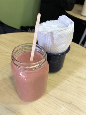 Jugo natural. Me gustó el detalle del mezclador de madera y las servilletas en un pocillo  at La Cocinita Verde in Bogota