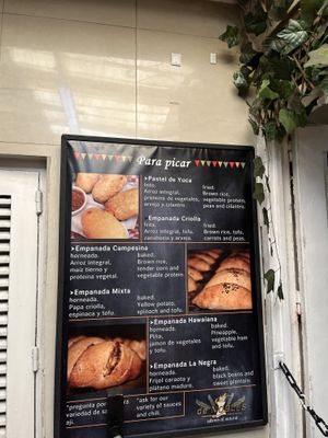 Vegan Empanadas, talmal Colombian tamales are a traditional, hearty dish consisting of seasoned corn dough and vegetables, all tightly wrapped in banana leaves.   at De Nobles in Bogota