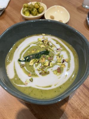 Pea, spinach, and pistachio soup with coconut milk  at Mifan - Open kitchen in Marrakech-safi