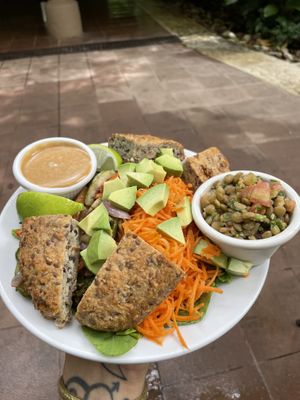 Beet and arugula salad with miso dressing sans beets and with roasted veggies in their place + a side of lentils and an extra side of their house made seeded bread❤️😍❤️ at Juice Bar at the Harmony Hotel in Nosara