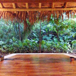 Open air yoga center at the Harmony Hotel, adjacent to the Cafe & Juice Bar.  Hotel guests receive 2 free class vouchers.  Classes ranged from very easy to advanced.  The hotel also provides free use of surf boards for the nearby Playa Guiones.   at Juice Bar at the Harmony Hotel in Nosara