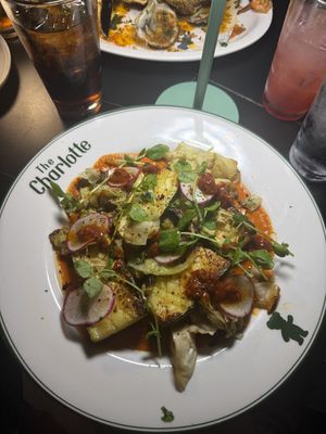 Charred cabbage & seared zucchini in Harissa. SO good  at The Charlotte American Bistro in Dallas