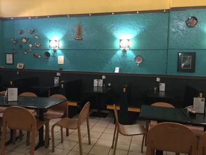 Interior shot of green walls and little tables   at Baja Bean Co in Staunton