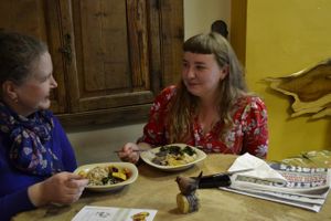 Mother and daughter enjoying their Gumbo and Stewed peas here at the Honey Hive Vegan cafe at The Calabash of Culture in South East London