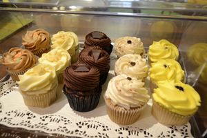 Carrot & Cinnamon, Vanilla, Double Chocolate Deluxe, Tiramisu, Lemon & Blueberry. All vegan and all amazing served with vegan custard or ice cream. at The Calabash of Culture in South East London