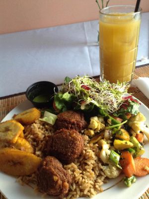 Fried lentils over rice, with plantains, mixed veggies, and a mixed, sprout, beet salad. The juice drink was carambola (starfruit). A great combination! at Ital in Paradise in St Croix