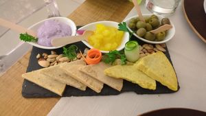 Mixed cheese platter with homemade pate and sauces at Gintilla in Cagliari