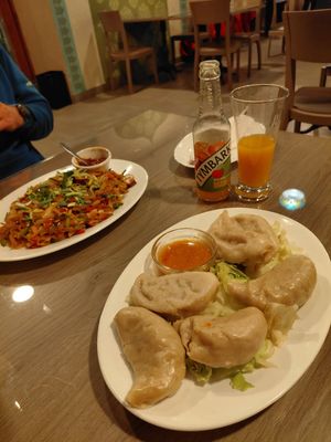 Vegetable momos (filled with cabbage) with a spicy indian sauce at Rikša - Curry & Wok in Ljubljana