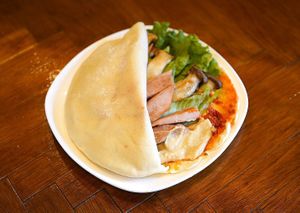 Vegan ham and mushroom pita with hummus and harissa. at Flying Mushroom Cafe in Tokyo