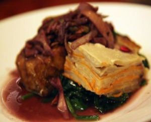 Porcini Crusted Tofu: sauteed spinach, root vegetable gratin, wild mushrooms, red wine sauce. at Candle 79 in New York City
