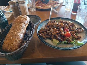 Salad with mushrum and tofu in Teriyaki sauce and bread at Cafe Optimi in Eilat