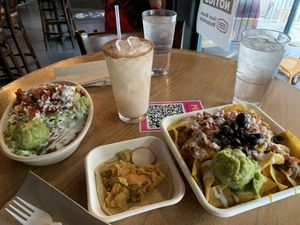 Left to right: Al pastor bowl, crispy jalapeño potato taco, and black bean nachos with horchata!  at El Borracho - Pike Place Market in Seattle