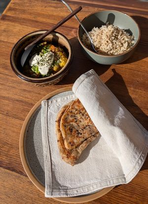 Vegetable Masala, coconut rice and sourdough spelt chapati!! at Moksha in Kaunas