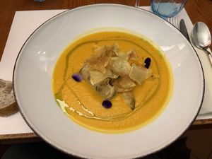 Pumpkin soup with marinated tofu and crispy potato chips  at MADREPERLA Bistrot in Friuli-venezia Giulia