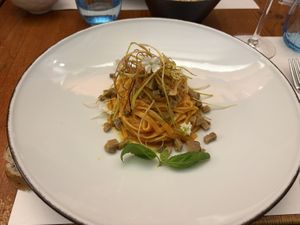 Tagliolini with roasted tomato cream with smoked seitan tartare and fried leek  at MADREPERLA Bistrot in Friuli-venezia Giulia