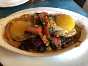 Black Bean Chilaquiles with “fried eggs" at Sanctuary Bistro in Charlotte