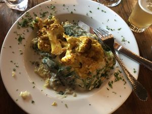 Cauliflower steak with rice and creamed spinach  at Sanctuary Bistro in Charlotte