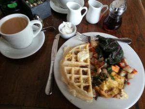 Plate as divided: Shiitake bacon and cheese waffle and Sanctuary omlet. at Sanctuary Bistro in Charlotte