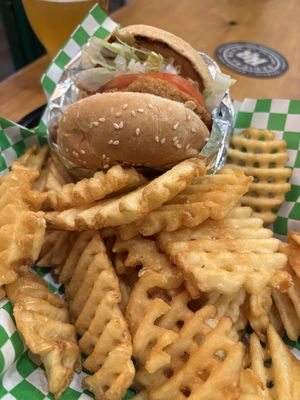 Vegan chicken burger with HUGE side of waffle friess  at Soy Boys in Toronto