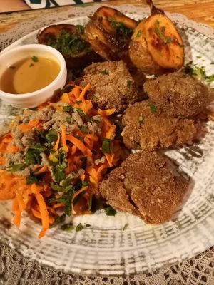 Soya medallions, roasted potatoes and carrots with tahini dressing at Moon in Siracusa